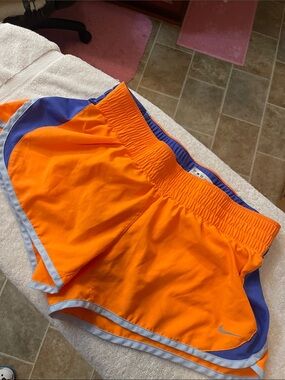Nike Women’s Orange Athletic Running Shorts with Blue Accents
